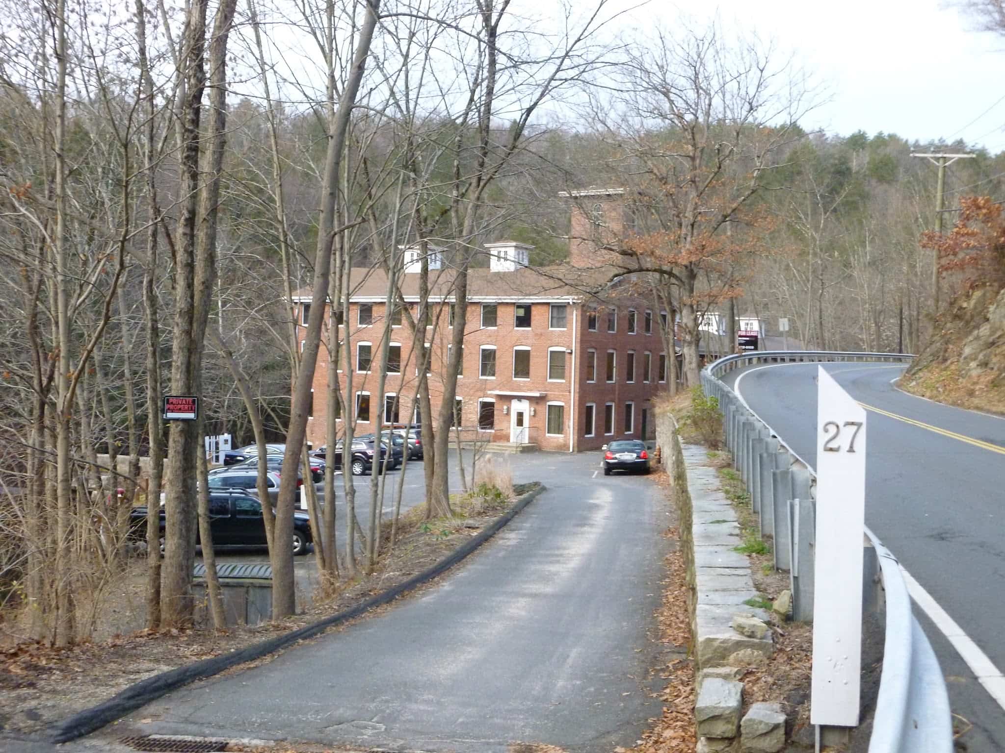 The mill building housing the Clinic, seen heading north on Glen Road.