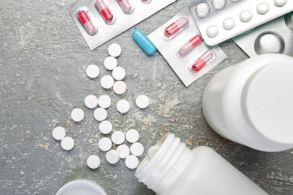 Banner of Pills. Medicine Pills in blister pack on grey background. Tablets and bottle.