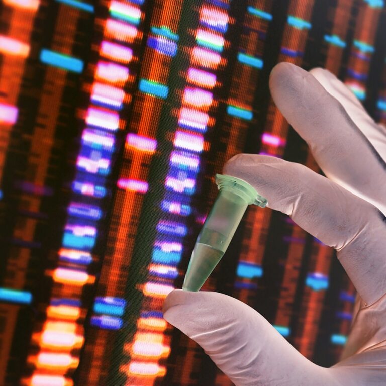 scientist holding DNA sample